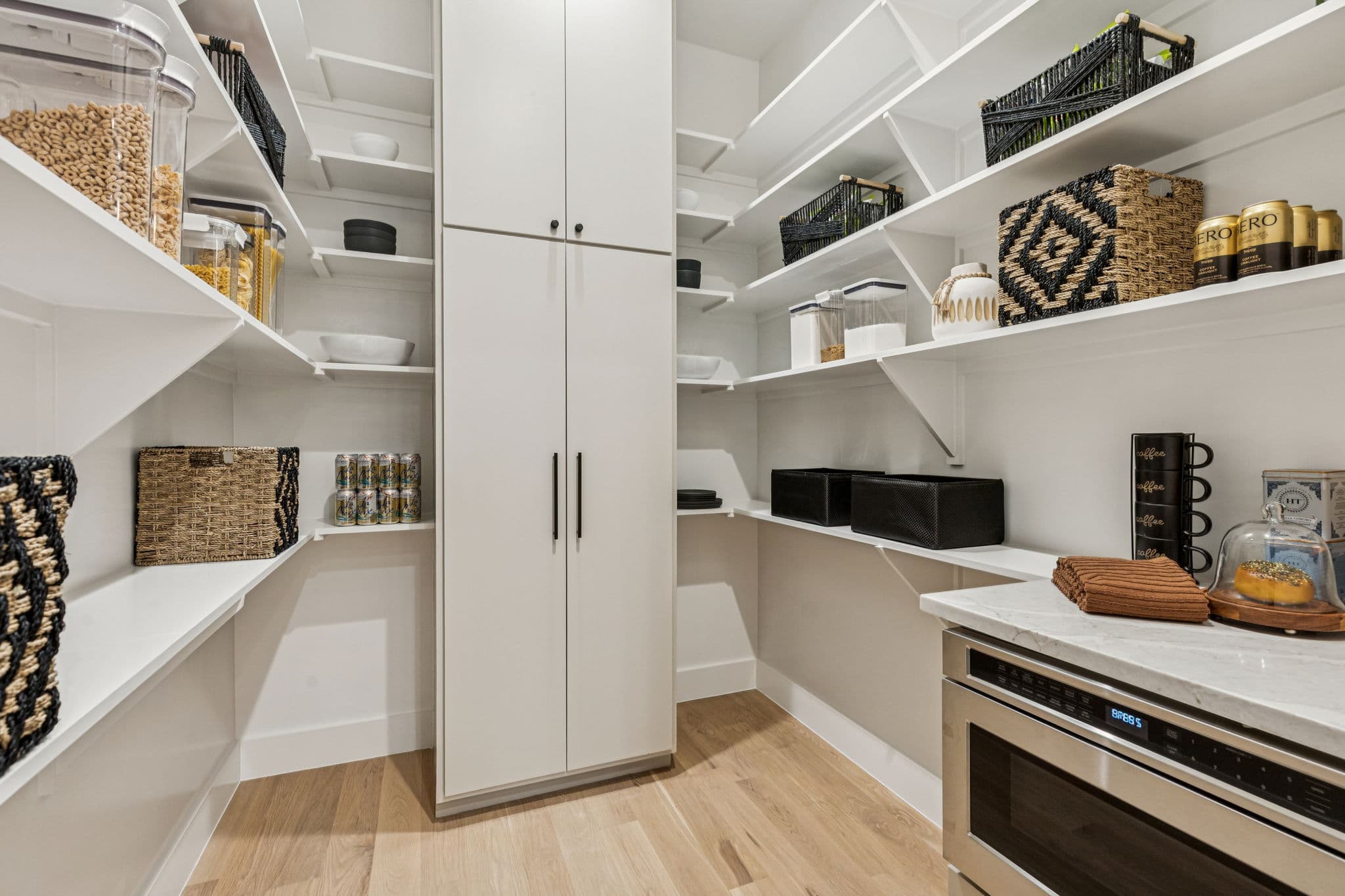 The pantry at 7707 Robin Road, open shelving around a run of counter.